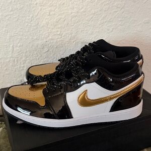 Nike Jordan 1 Low Black and Gold Low-Top Sneakers